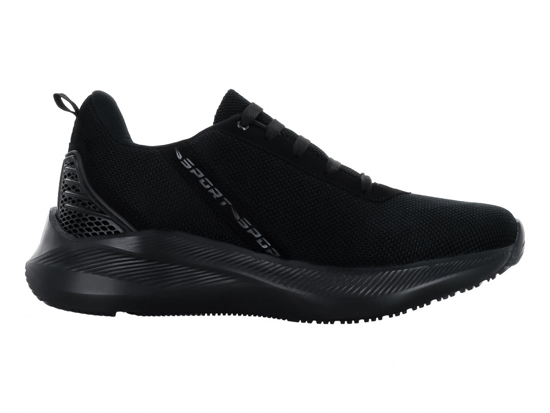 Tenis deportivo color negro con tejido de malla y suela gruesa.
