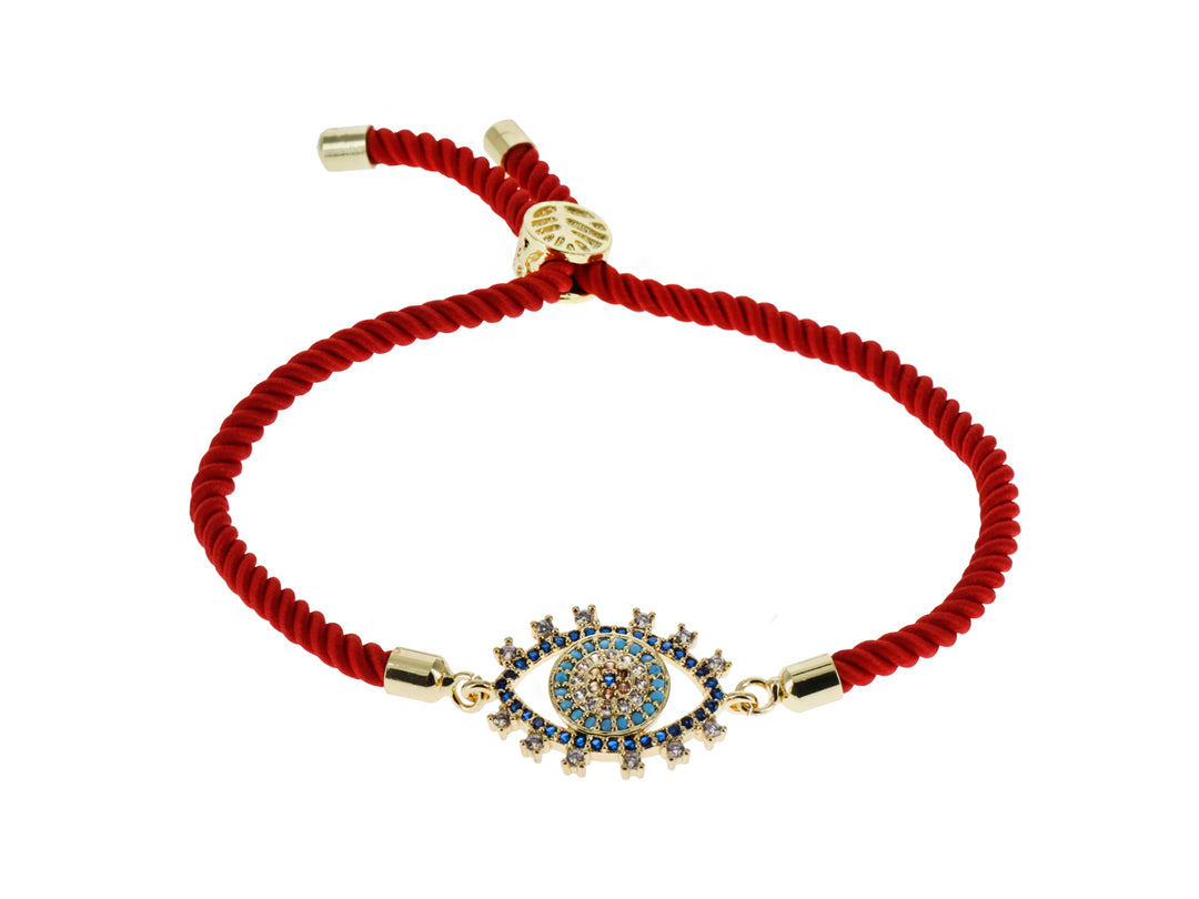 Pulsera de cordón rojo con dije central de ojo turco en color dorado y azul con detalles brillantes.