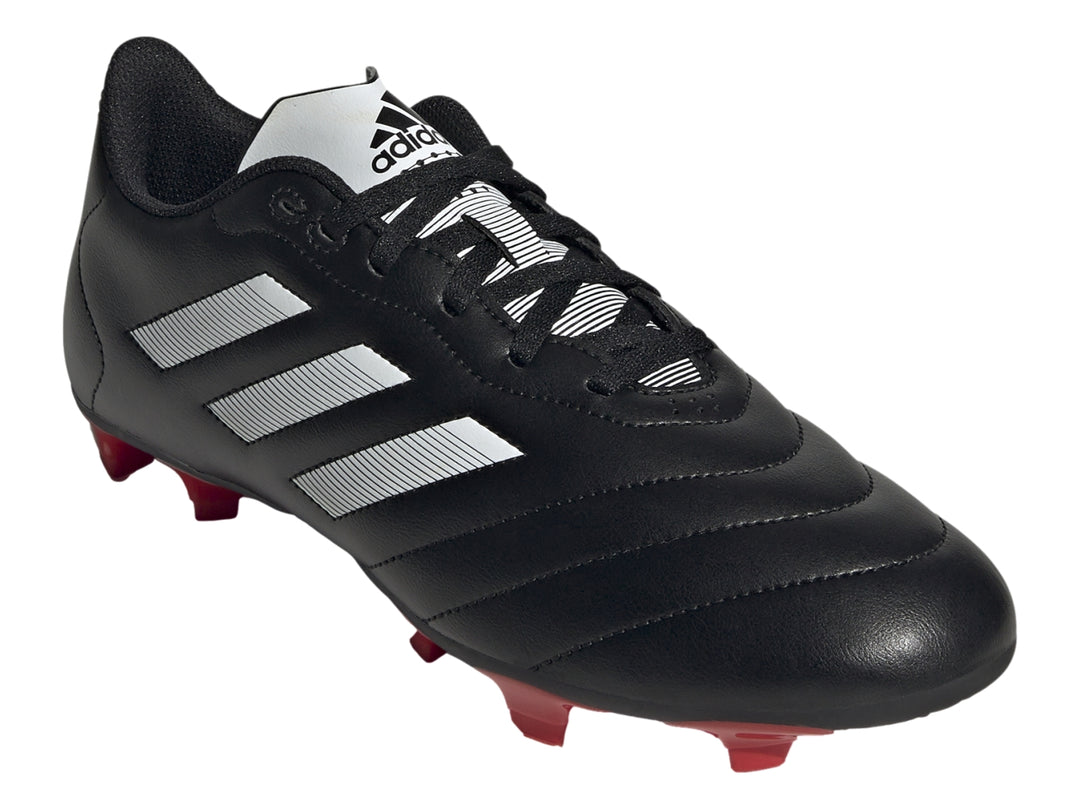 Botas de fútbol Adidas Goletto VIII en color negro con tres franjas blancas y tacos rojos.