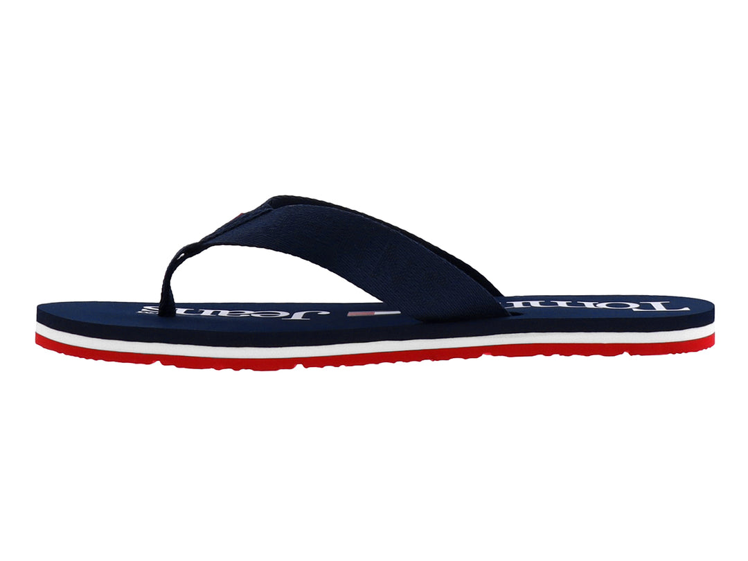 Sandalias Tommy Hilfiger color azul marino con suela en capas de color blanco y rojo.