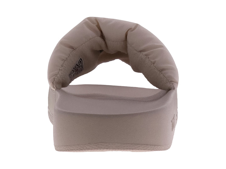 Sandalias Tommy Hilfiger color beige con correa acolchada y suela plana.