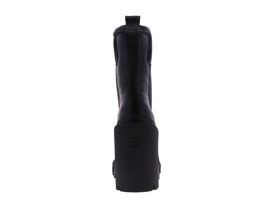 Botín negro Guess con tacón grueso y suela de plataforma dentada.