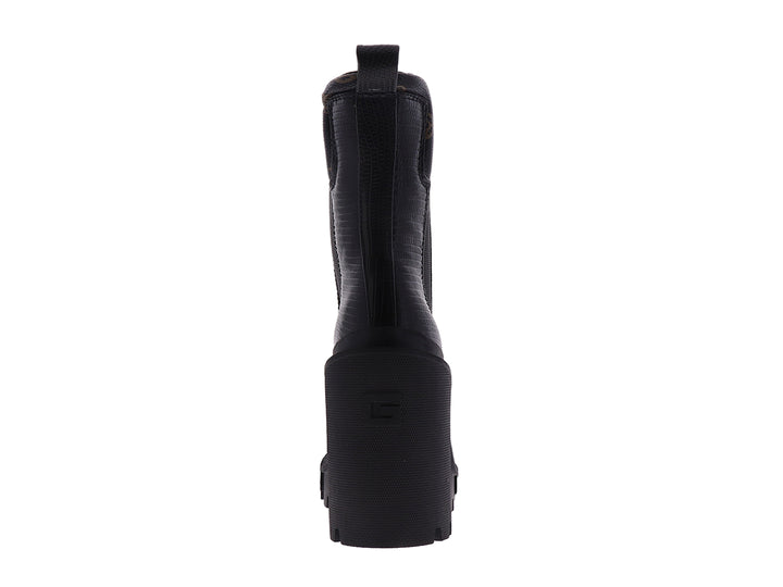Botín negro Guess con tacón grueso y suela de plataforma dentada.