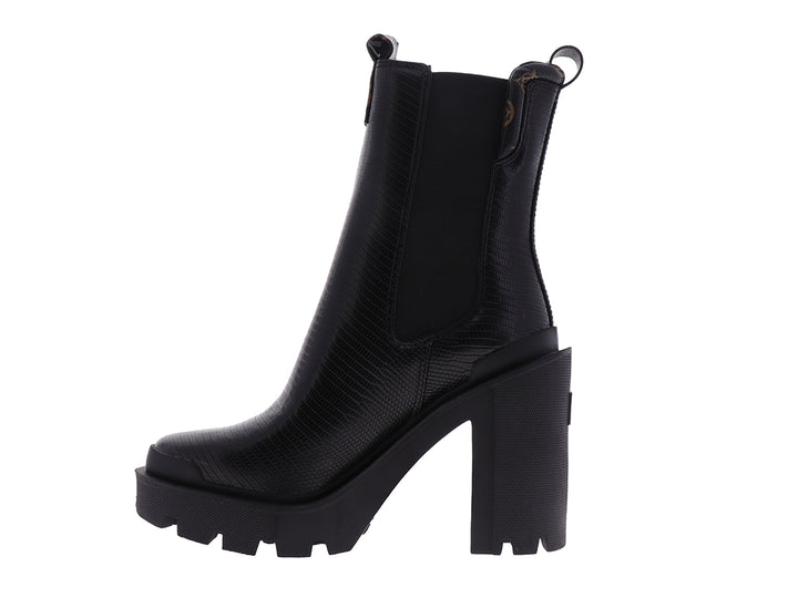 Botín negro Guess con tacón grueso y suela de plataforma dentada.