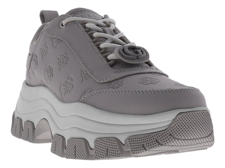 Tenis Guess GW Bria en color azul grisáceo con suela de plataforma gruesa y detalles grabados.