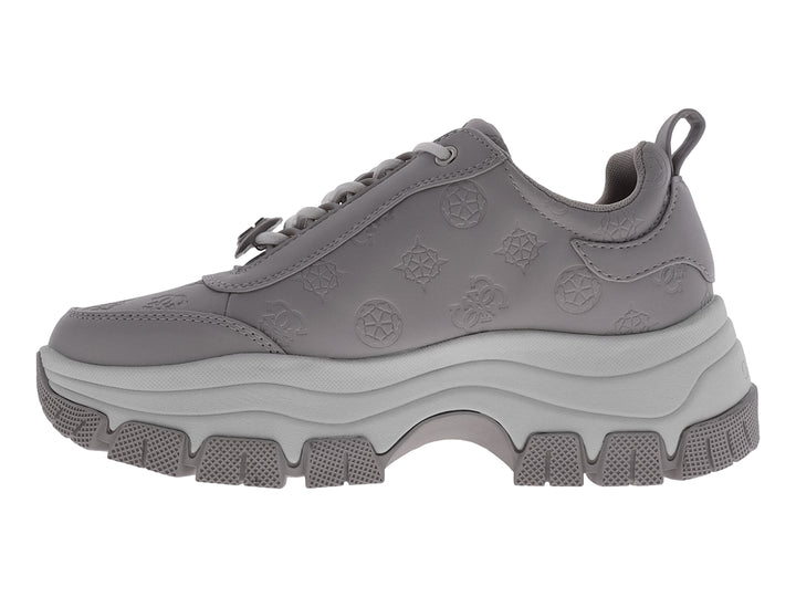Tenis Guess GW Bria en color azul grisáceo con suela de plataforma gruesa y detalles grabados.