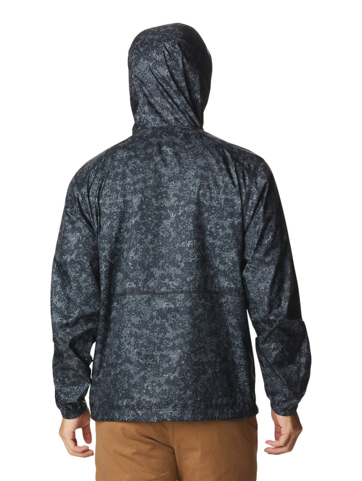 Rompevientos Columbia negro con estampado de puntos grises, capucha y cierre frontal.