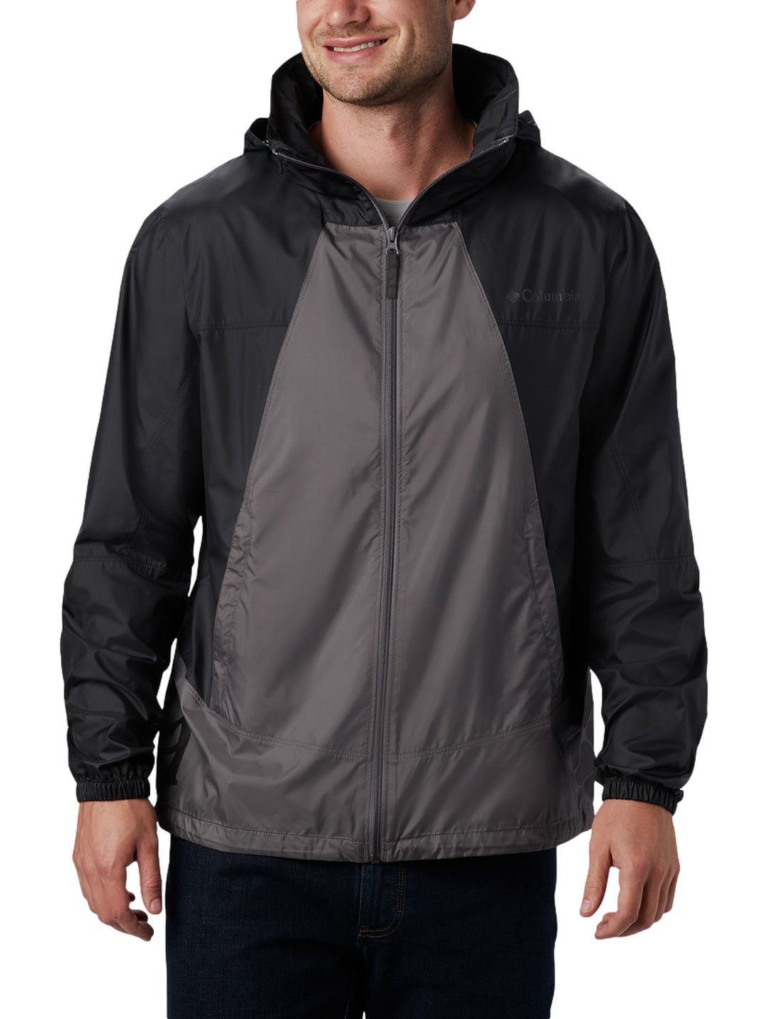 Chaqueta rompevientos Columbia bicolor en gris y negro con capucha y cierre frontal.