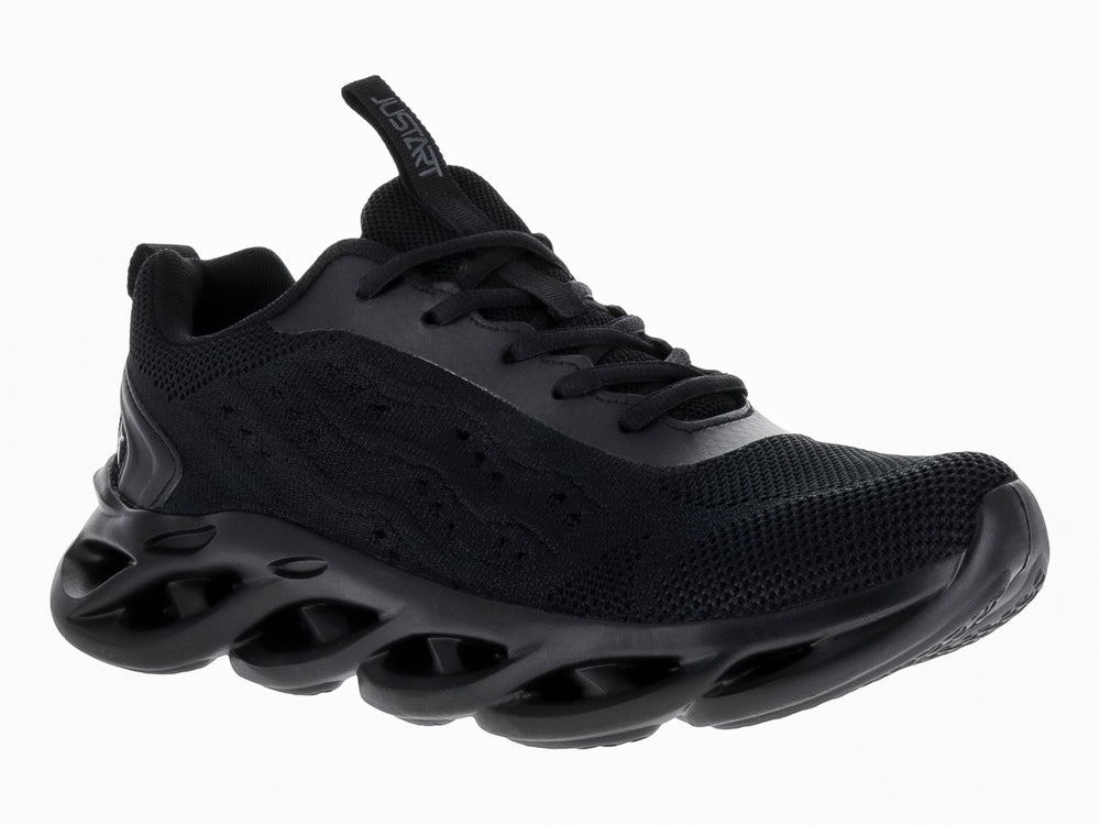 Tenis de baloncesto JUSTART color negro con suela ondulada y diseño futurista.