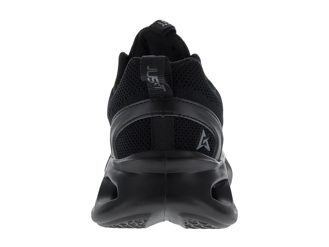 Tenis de baloncesto JUSTART color negro con suela ondulada y diseño futurista.