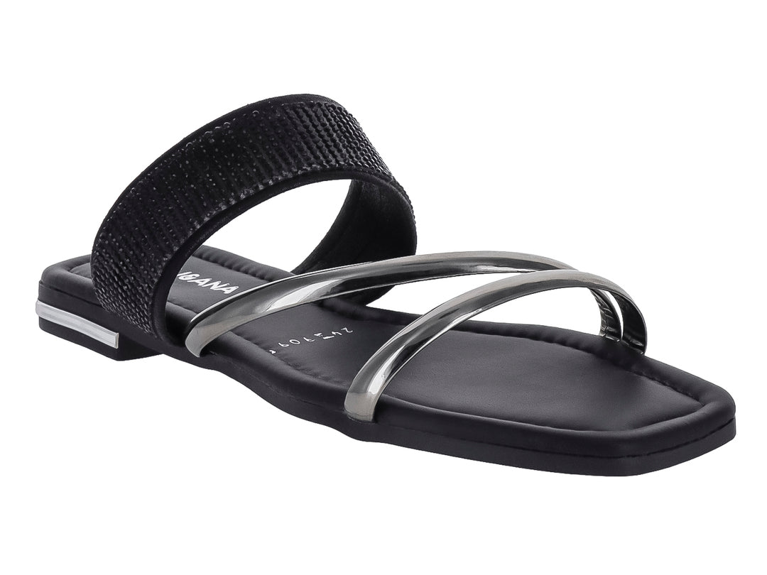 Sandalia plana para Niña de color negro con tiras brillantes y detalles en color plata.