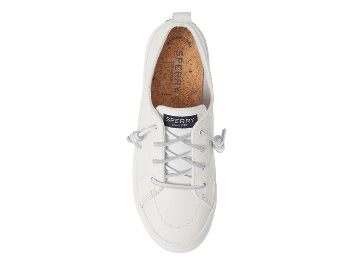 Tenis blancos de plataforma marca Sperry con cordones y suela gruesa.