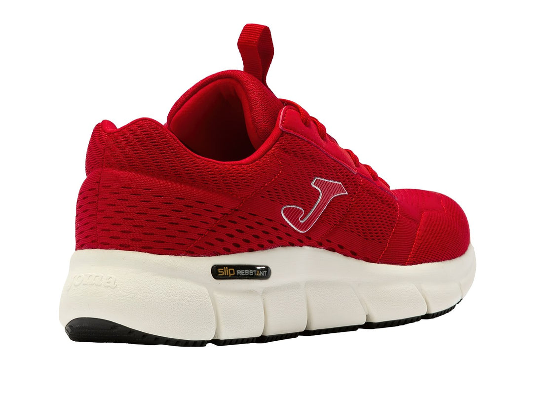 Tenis deportivos Joma de color rojo con suela blanca y detalles en negro.