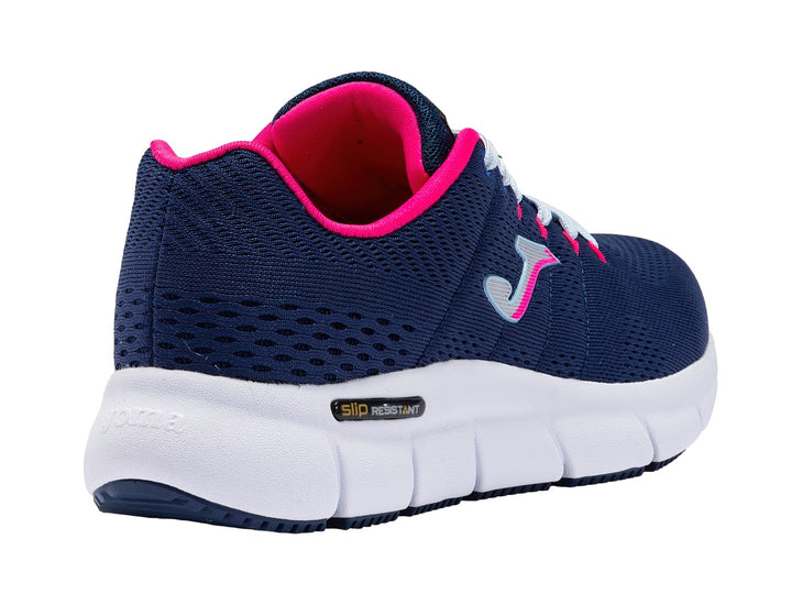 Tenis deportivos Joma color azul marino con suela blanca y detalles en rosa.