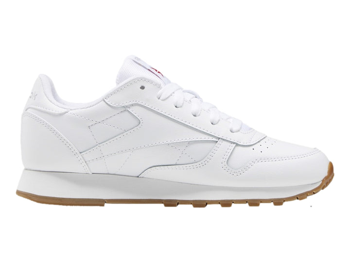 Tenis Reebok blancos de cuero con suela color café para niños pequeños.