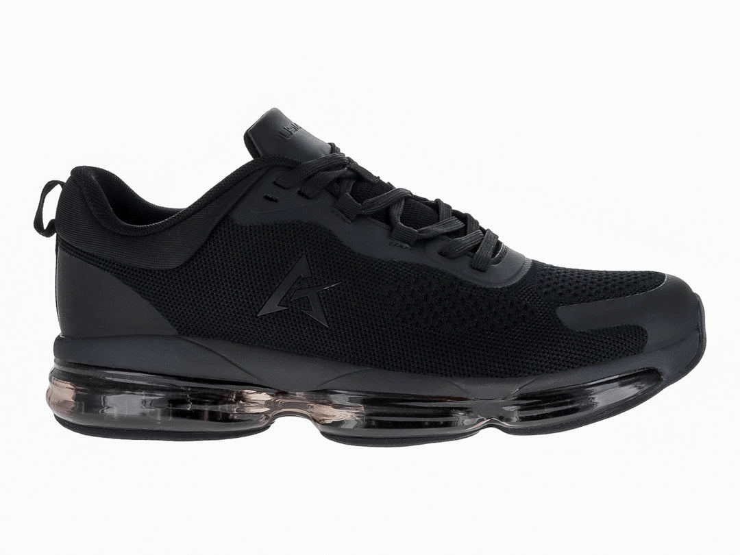 Tenis de baloncesto JUSTART color negro con suela transparente y tejido de malla.