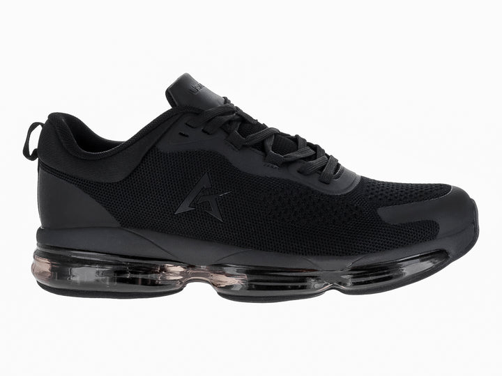 Tenis de baloncesto JUSTART color negro con suela transparente y tejido de malla.