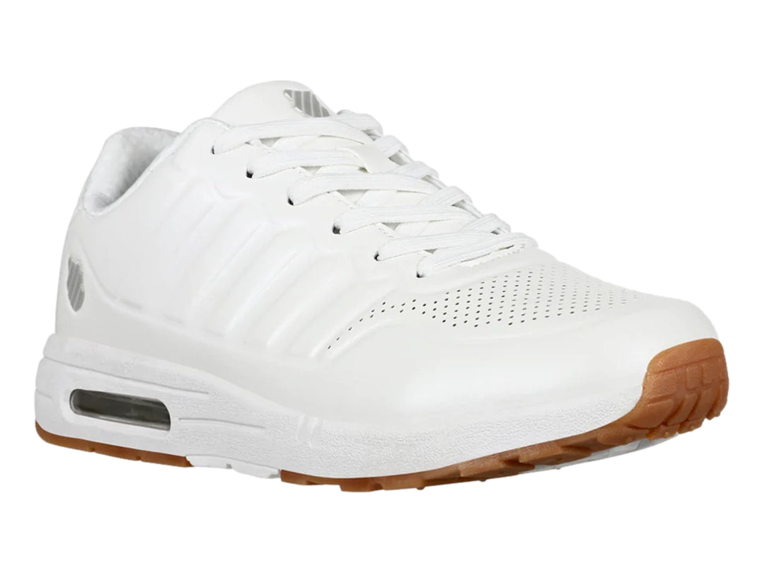 Tenis deportivos K-Swiss color blanco con suela de goma marrón y cámara de aire visible en el talón.