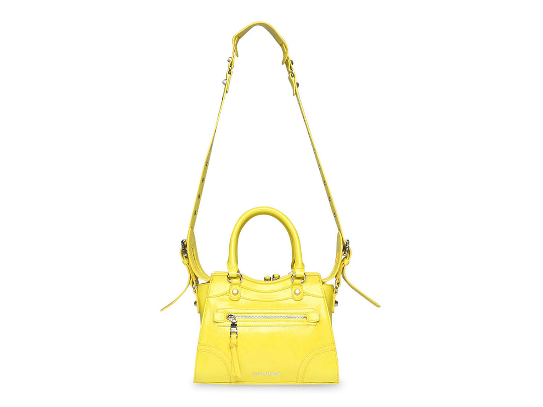 Bolso de mano amarillo de Steve Madden con asas superiores y correa larga ajustable.