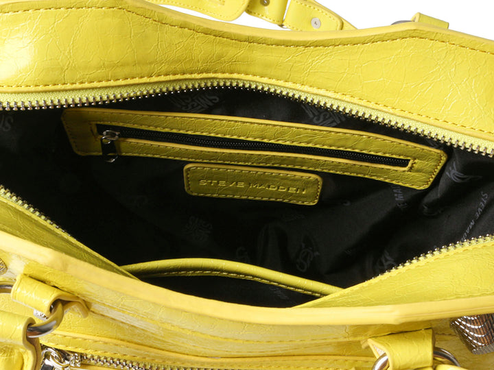 Bolso de mano amarillo de Steve Madden con asas superiores y correa larga ajustable.
