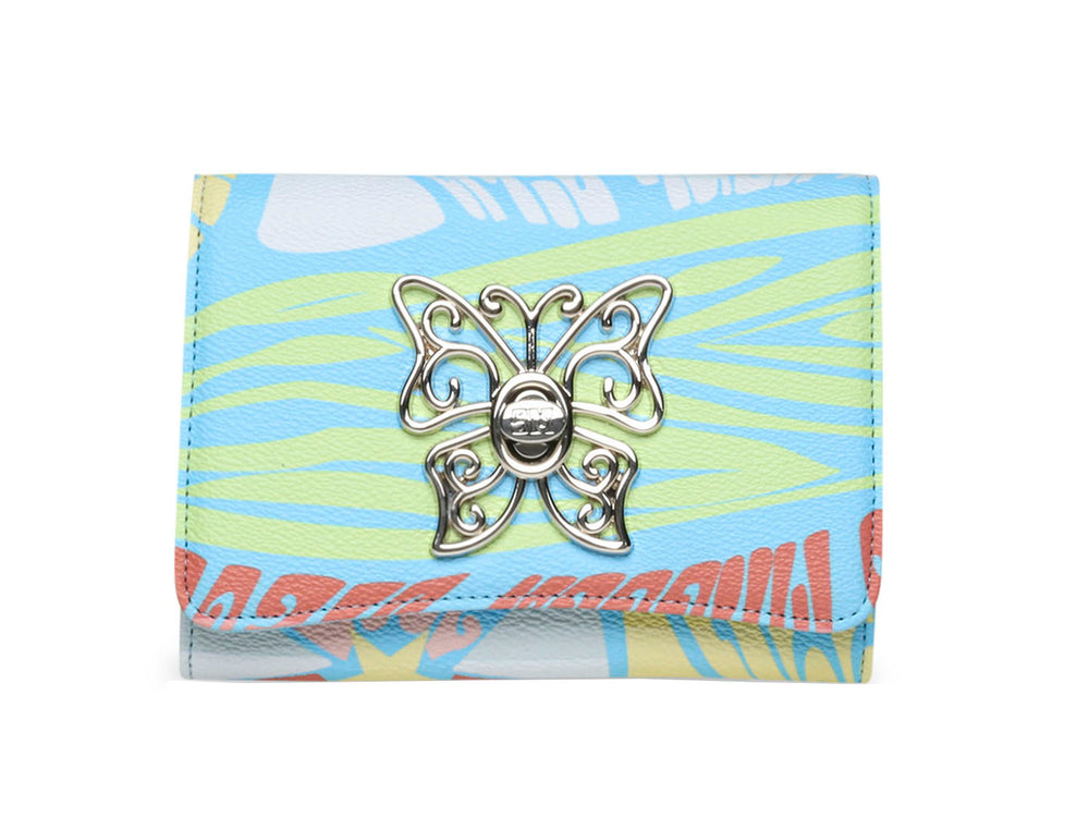 Cartera Steve Madden con estampado floral en tonos azul, amarillo y rosa.