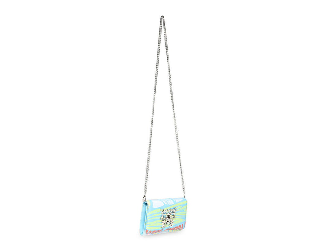 Cartera Steve Madden con estampado floral en tonos azul, amarillo y rosa.