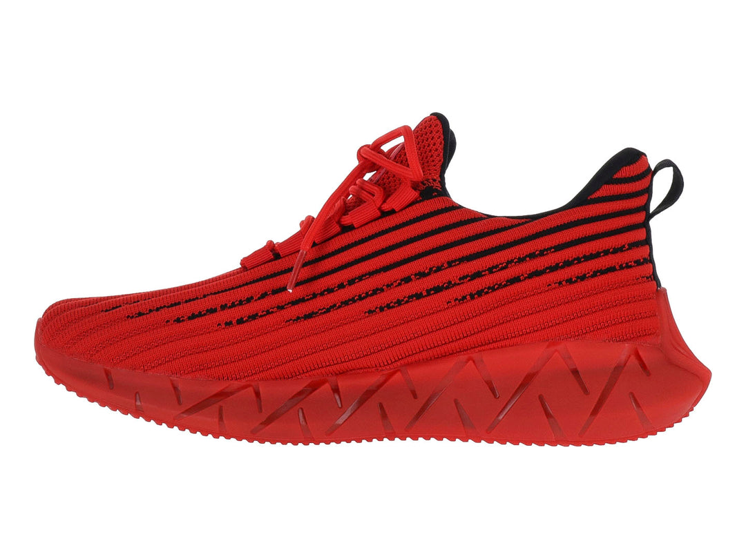 Tenis deportivos rojos con rayas negras y suela gruesa esculpida.