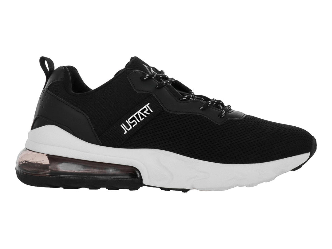 Tenis deportivos Justart color negro con suela blanca y amortiguación de aire en el talón.
