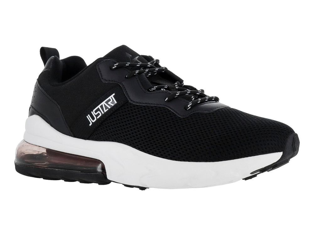Tenis deportivos Justart color negro con suela blanca y amortiguación de aire en el talón.
