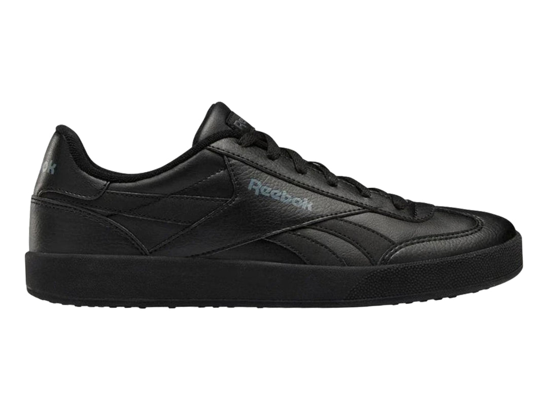 Tenis deportivos Reebok color negro con suela plana y logotipo lateral.