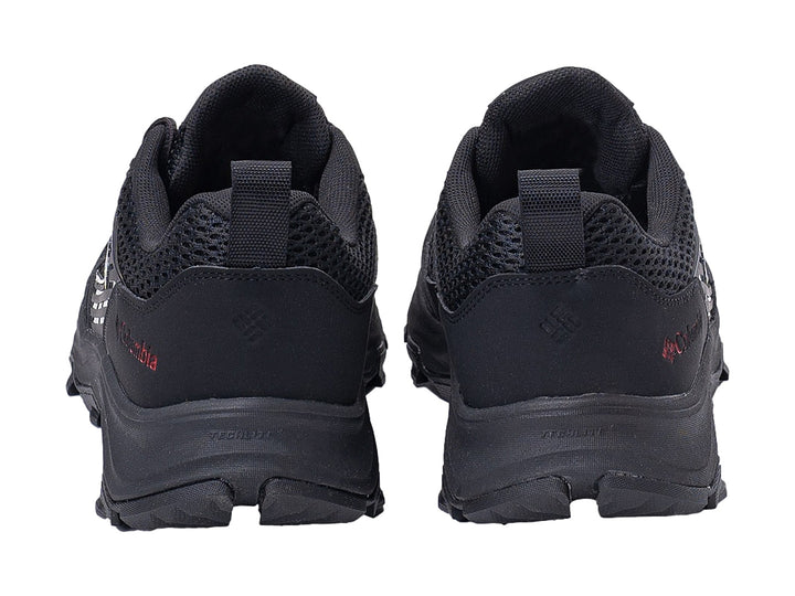 Par de tenis Columbia Hatana Breathe en color negro con detalles rojos y suela robusta para senderismo.