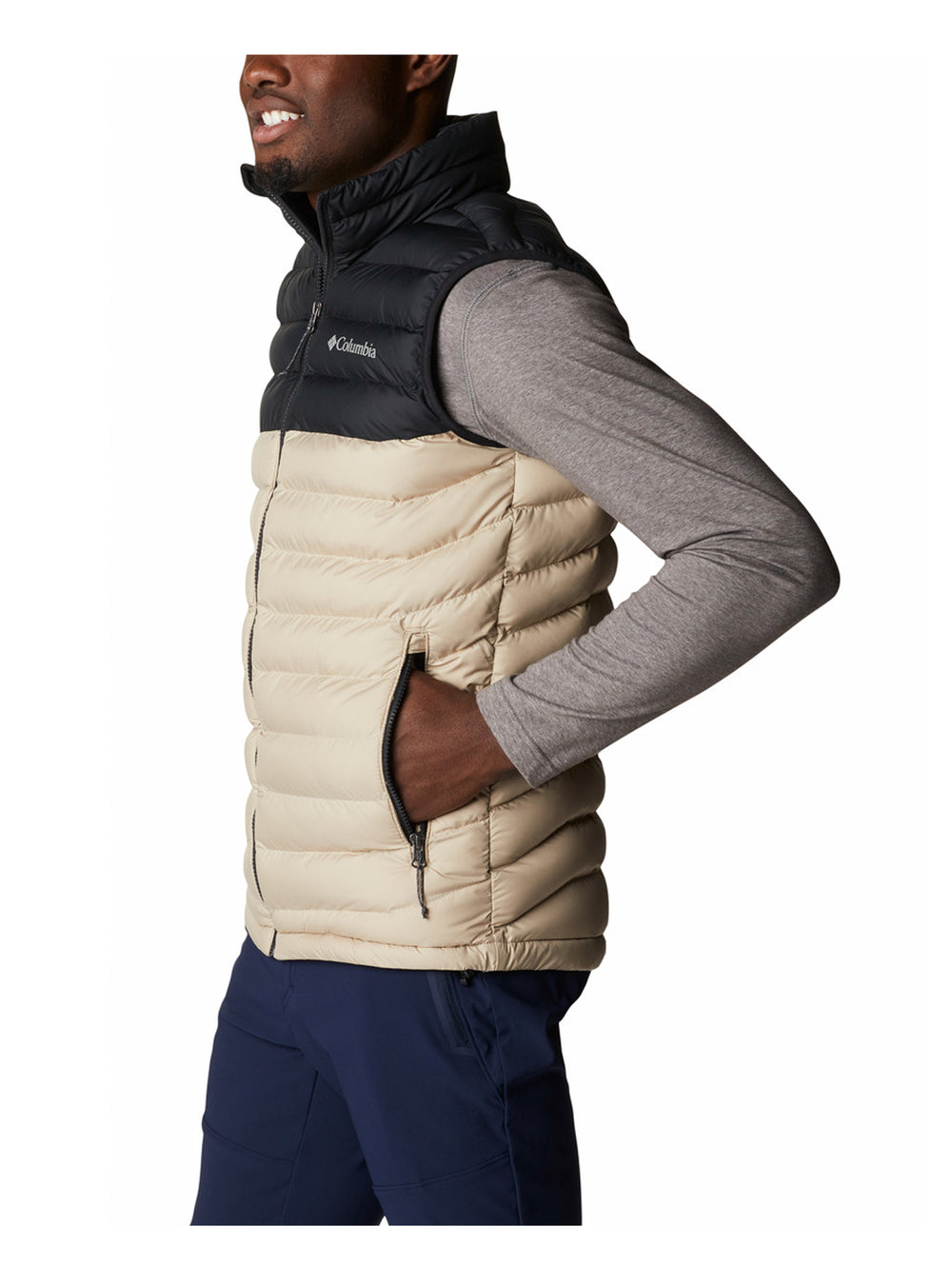 Chaleco acolchado Columbia bicolor en negro y beige para hombre.