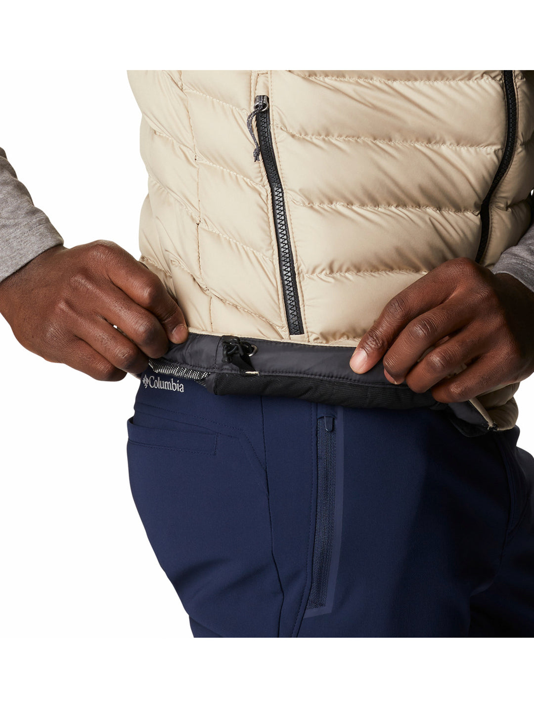 Chaleco acolchado Columbia bicolor en negro y beige para hombre.