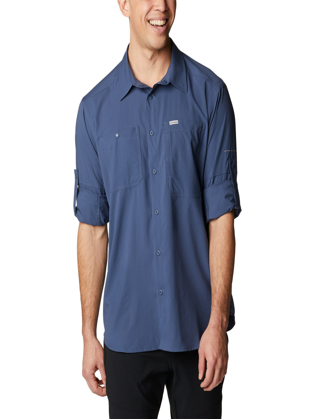 Camisa Columbia de manga larga en color azul oscuro con cuello y botones frontales.