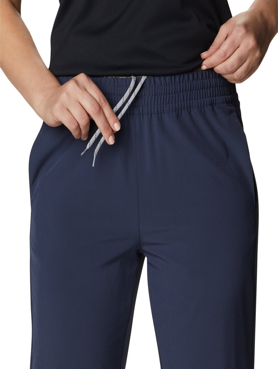 Pantalones de senderismo Columbia color azul marino con cintura elástica y cordón ajustable.