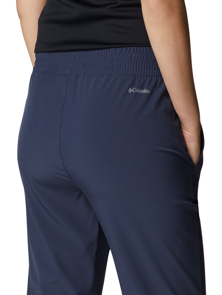 Pantalones de senderismo Columbia color azul marino con cintura elástica y cordón ajustable.