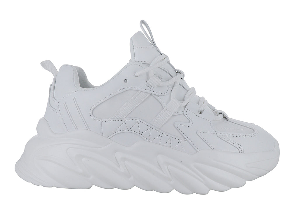 Tenis blancos de plataforma con suela ondulada y diseño moderno.