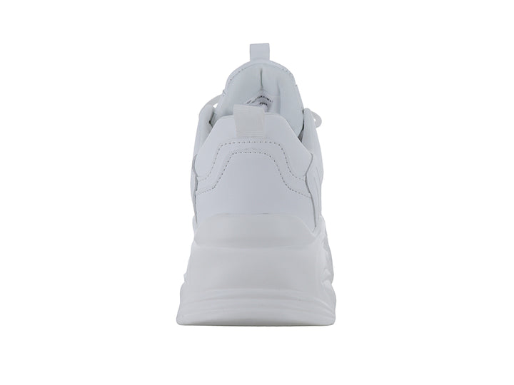 Tenis blancos de plataforma con suela ondulada y diseño moderno.
