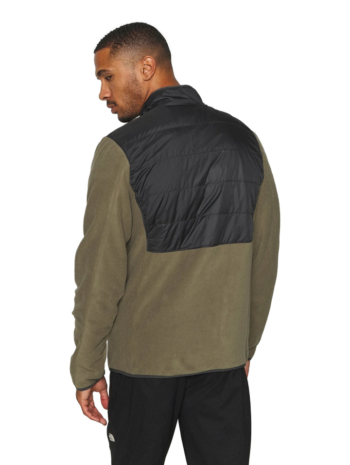 Chaqueta Columbia bicolor verde oliva y negro con panel superior acolchado y cierre frontal.