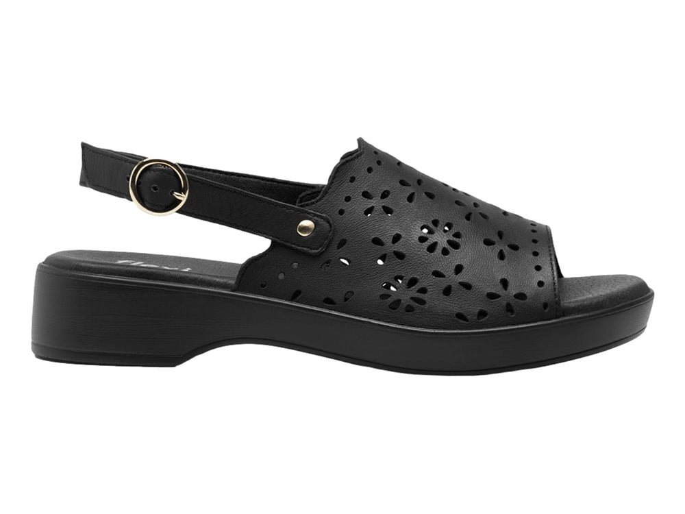 Sandalia negra de cuero con perforaciones florales, plataforma y correa ajustable al tobillo.