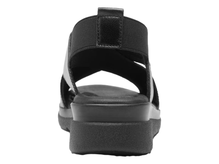 Sandalia Flexi color negro para mujer con diseño de correas cruzadas y suela de plataforma.