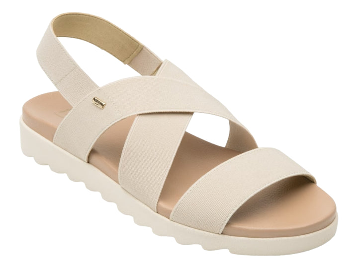 Sandalia Flexi para mujer en color beige con correas textiles cruzadas y suela blanca ondulada.