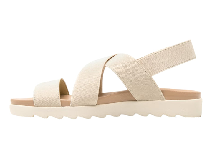 Sandalia Flexi para mujer en color beige con correas textiles cruzadas y suela blanca ondulada.