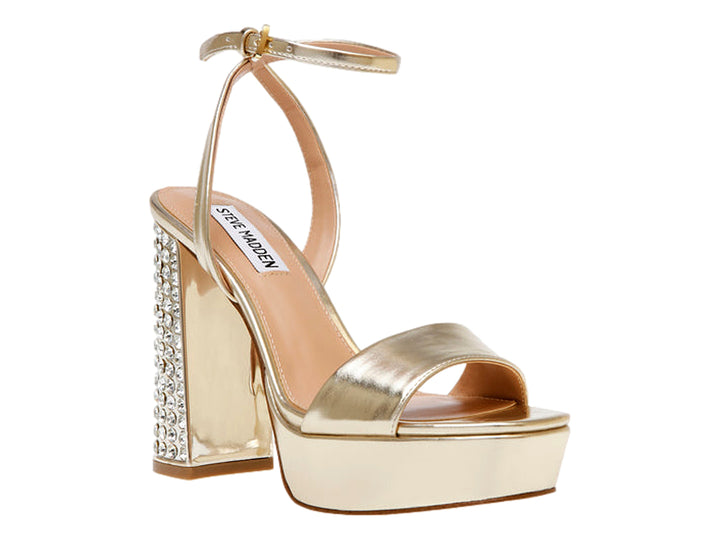 Sandalia dorada Steve Madden con tacón grueso adornado con cristales, plataforma y correa al tobillo.