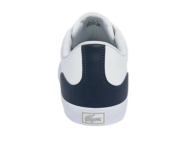 Tenis Lacoste blancos con talón azul marino y logotipo de cocodrilo verde.