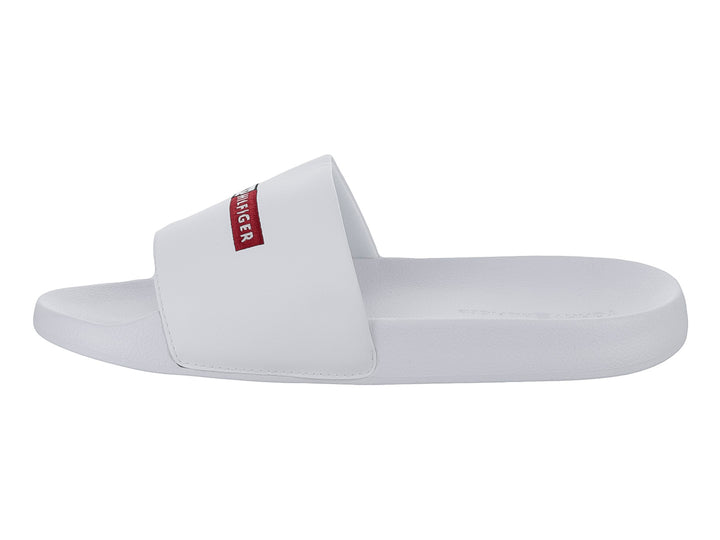 Sandalia deslizable Tommy Hilfiger de color blanco con logotipo en la banda superior.