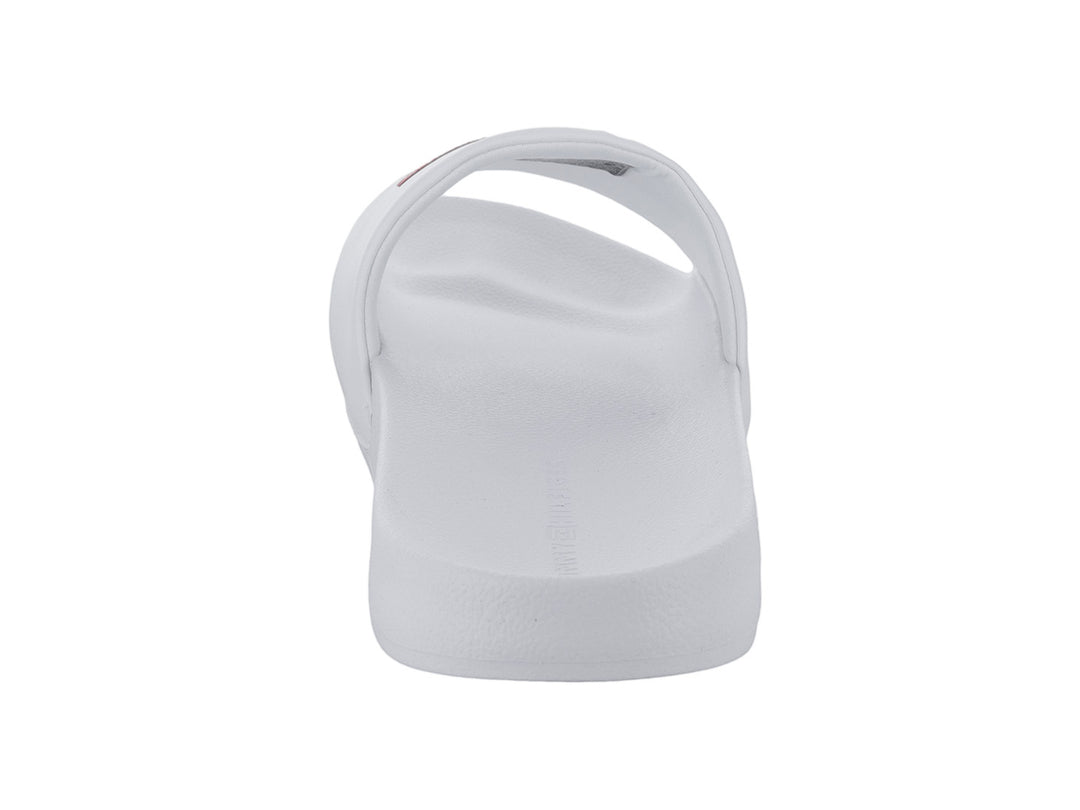 Sandalia deslizable Tommy Hilfiger de color blanco con logotipo en la banda superior.