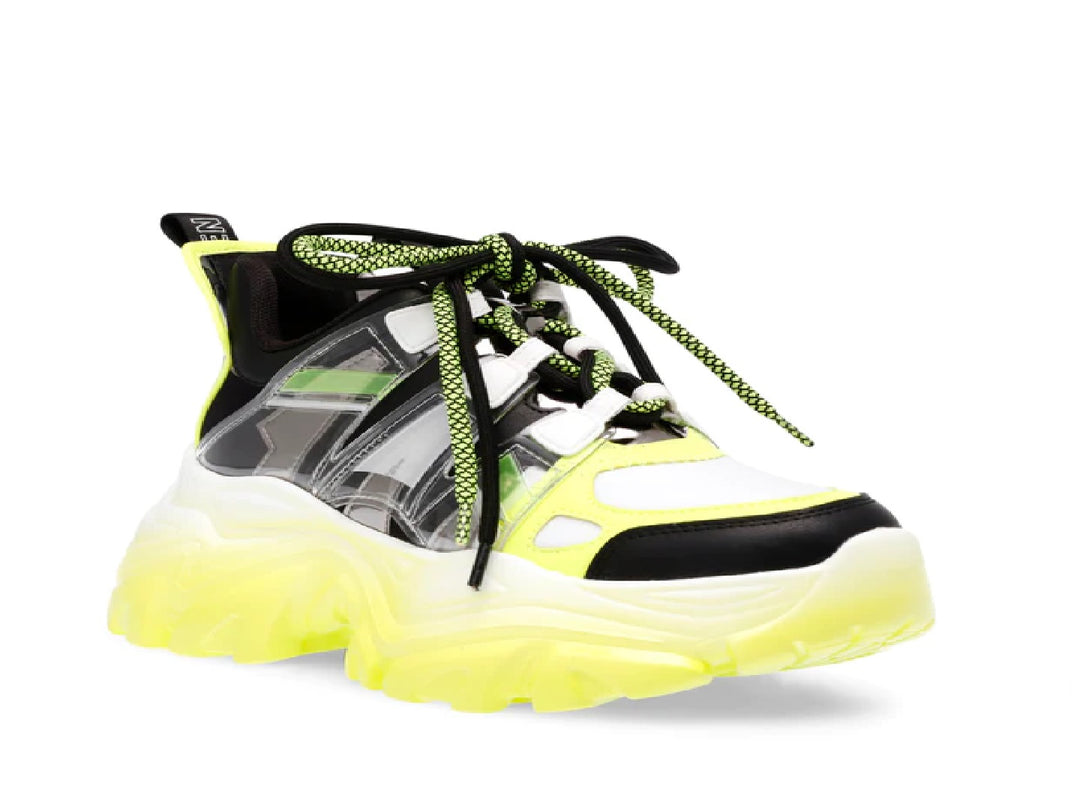 Tenis Steve Madden Riptide en colores negro, blanco y amarillo neón con suela gruesa y estilo deportivo.