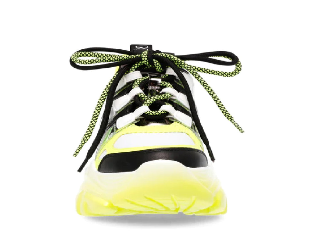 Tenis Steve Madden Riptide en colores negro, blanco y amarillo neón con suela gruesa y estilo deportivo.