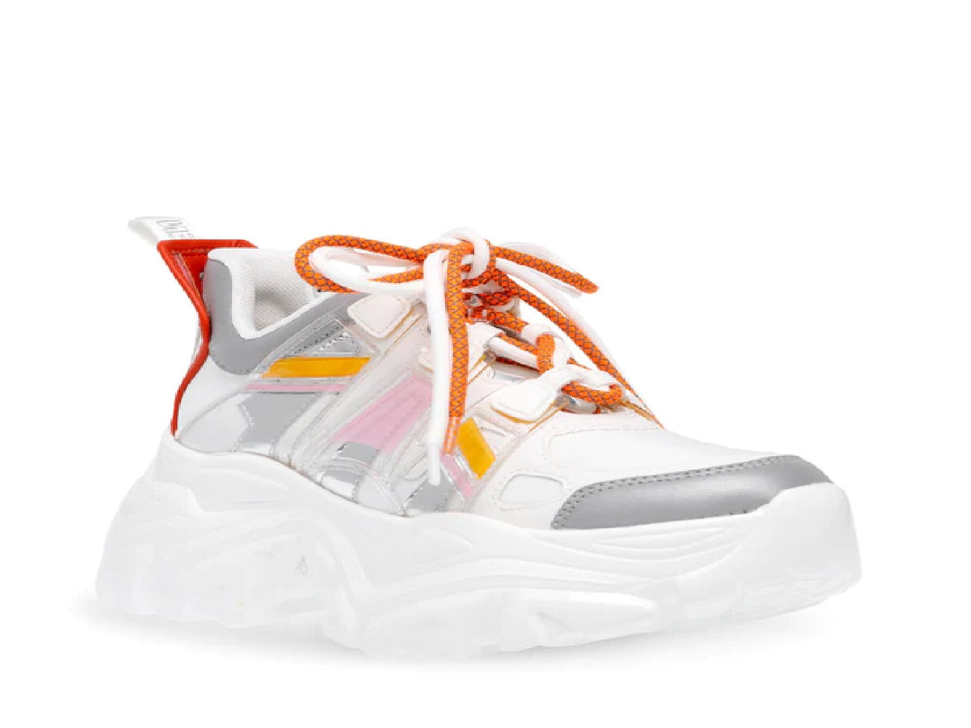 Tenis Steve Madden Riptid en color blanco y plata con detalles en naranja y amarillo, suela ancha y estilo chunky.